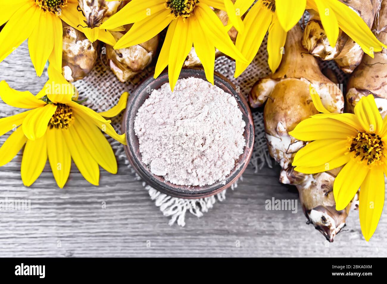 Jerusalem Artichoke Flour In A Clay Bowl On A Burlap With Flowers And Vegetables On Wooden Board Background From Above Stock Photo Alamy