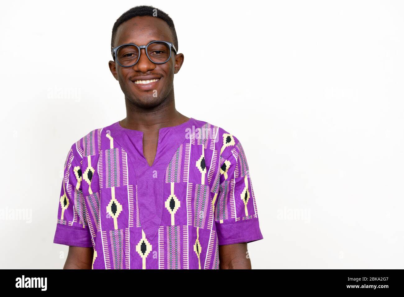 Portrait of happy young African man in traditional clothing Stock Photo ...
