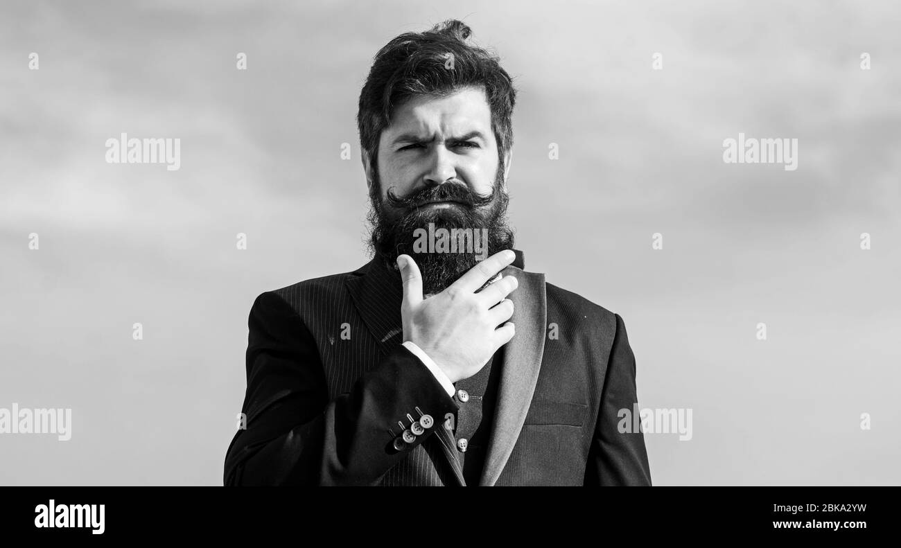 Vintage style long beard. Facial hair beard and mustache care. Beard fashion  trend. Invest in stylish appearance. Grow thick beard fast. Man bearded  hipster wear formal suit blue sky background Stock Photo -