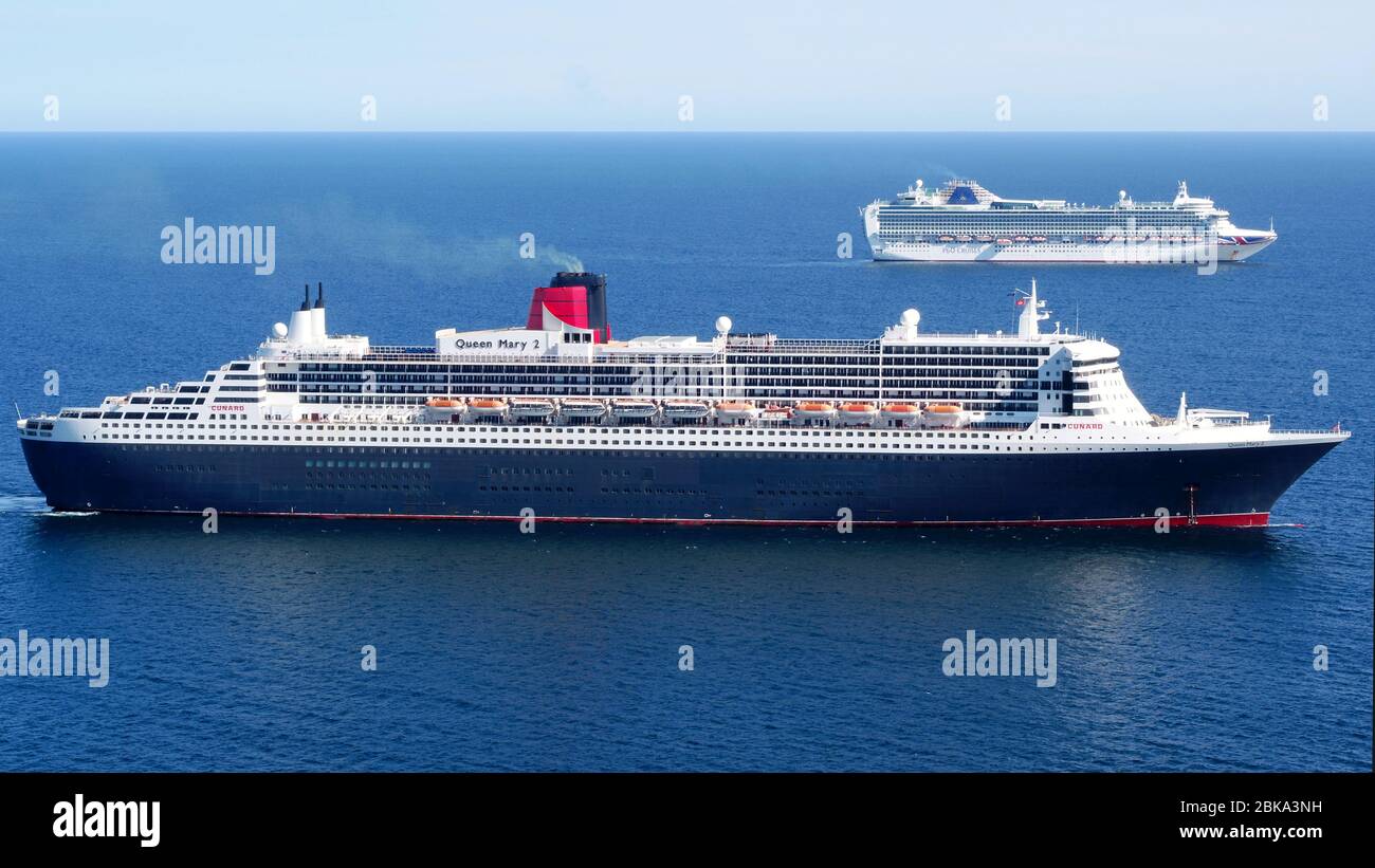 Weymouth, England. 2nd May, 2020. RMS Queen Mary 2 transatlantic ocean liner, flagship of Cunard Line, arrives to join P&O ships Aurora and its sister ship Ventura in the bay off Weymouth and Portland. Picture by Paul Hoskins/Eagle Vista Credit: Dorset Media Service/Alamy Live News Stock Photo