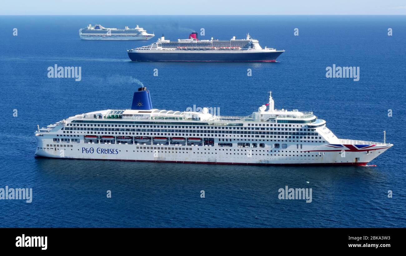 Weymouth, England. 2nd May, 2020. RMS Queen Mary 2 transatlantic ocean liner, flagship of Cunard Line, arrives to join P&O ships Aurora and its sister ship Ventura in the bay off Weymouth and Portland. Picture by Paul Hoskins/Eagle Vista Credit: Dorset Media Service/Alamy Live News Stock Photo