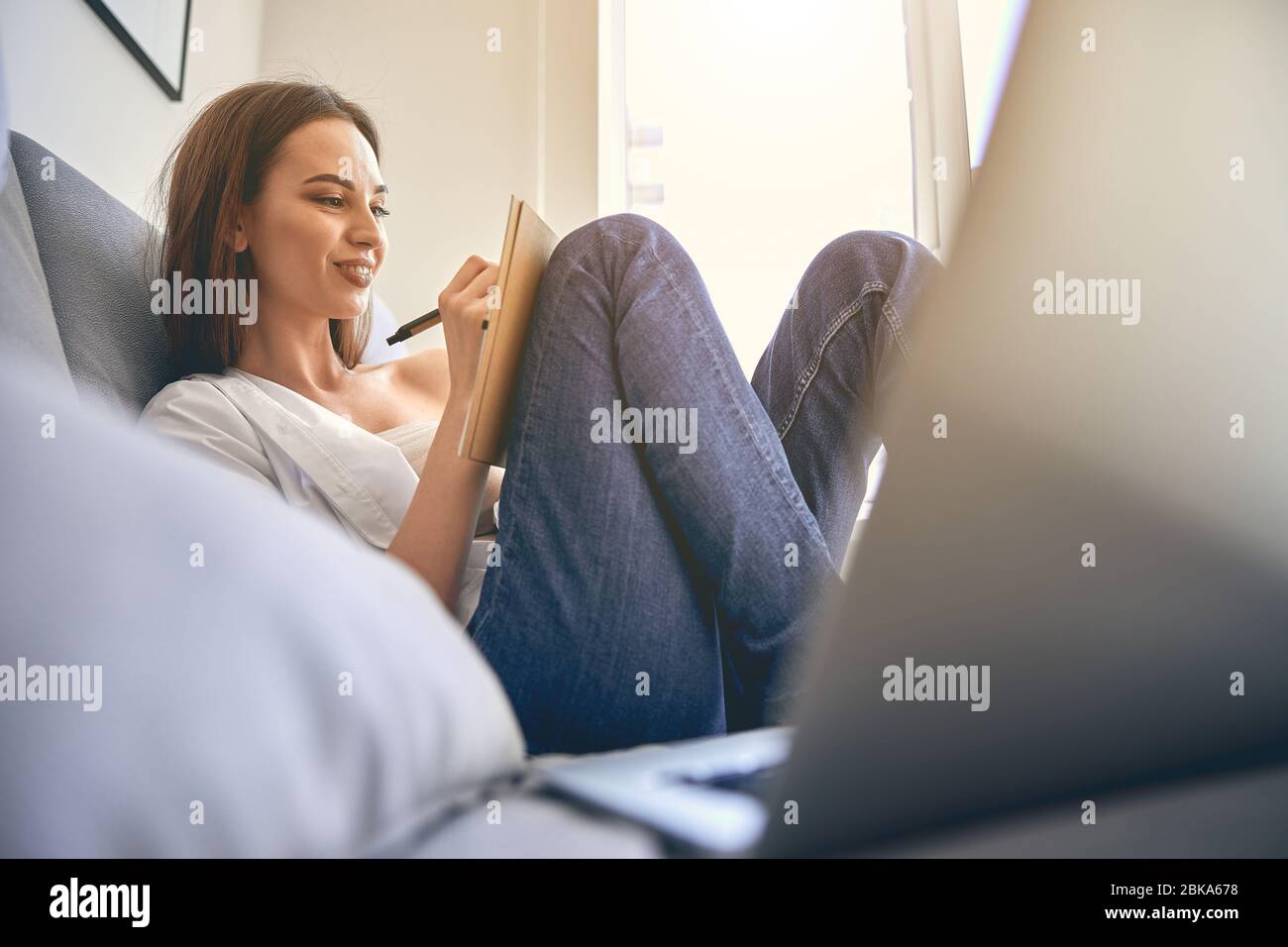Caucasian young female freelancer working from home Stock Photo