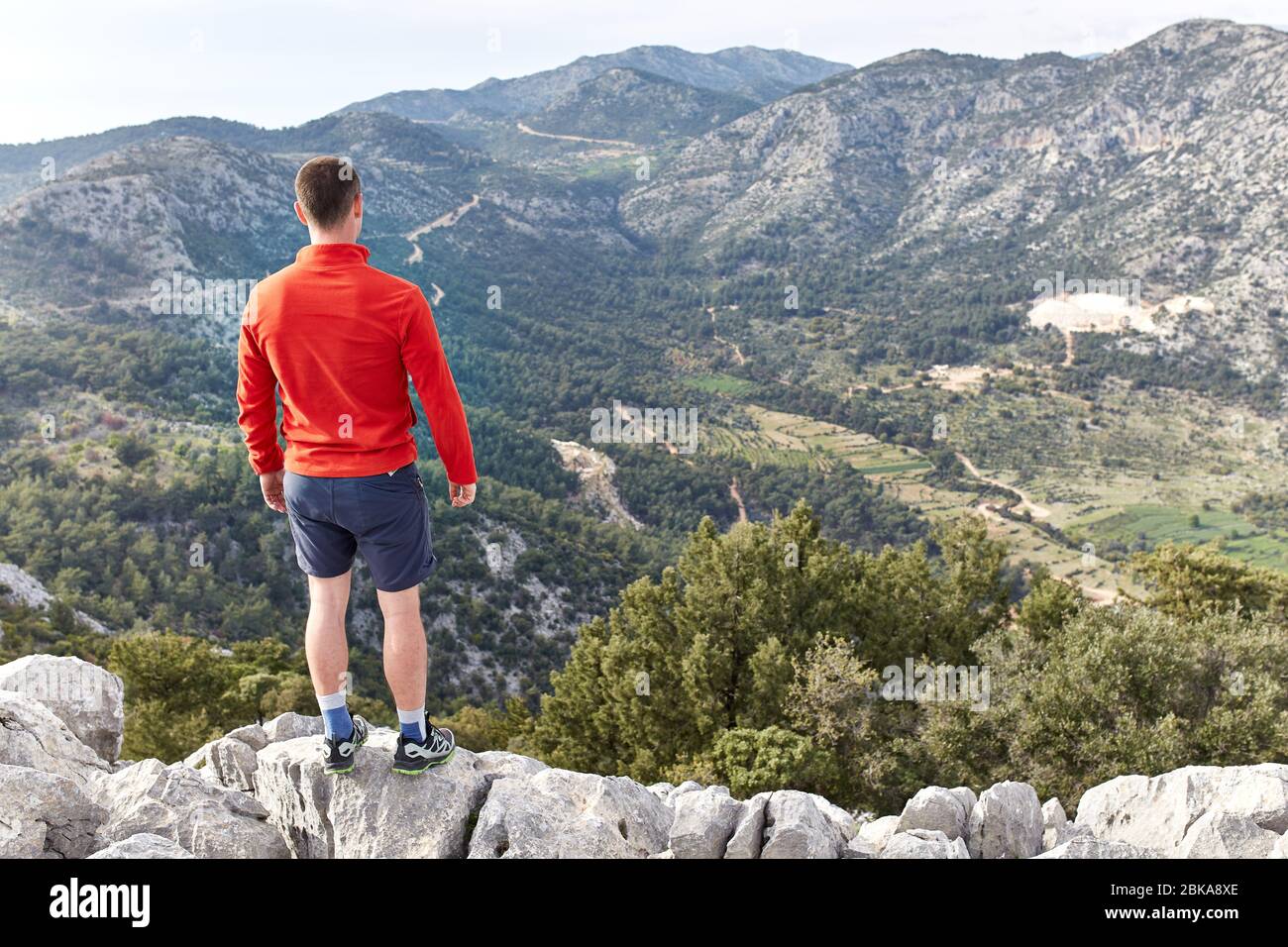 Young hiker on mountain peak hi-res stock photography and images - Alamy