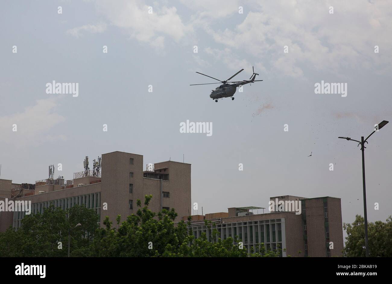 New Delhi, India. 3rd May, 2020. An Indian Air Force helicopter showers flower petals at the All India Institute of Medical Sciences (AIIMS) to pay tribute to doctors, nurses and police personnel who battle against COVID-19 pandemic in New Delhi, India, May 3, 2020. Credit: Javed Dar/Xinhua/Alamy Live News Stock Photo