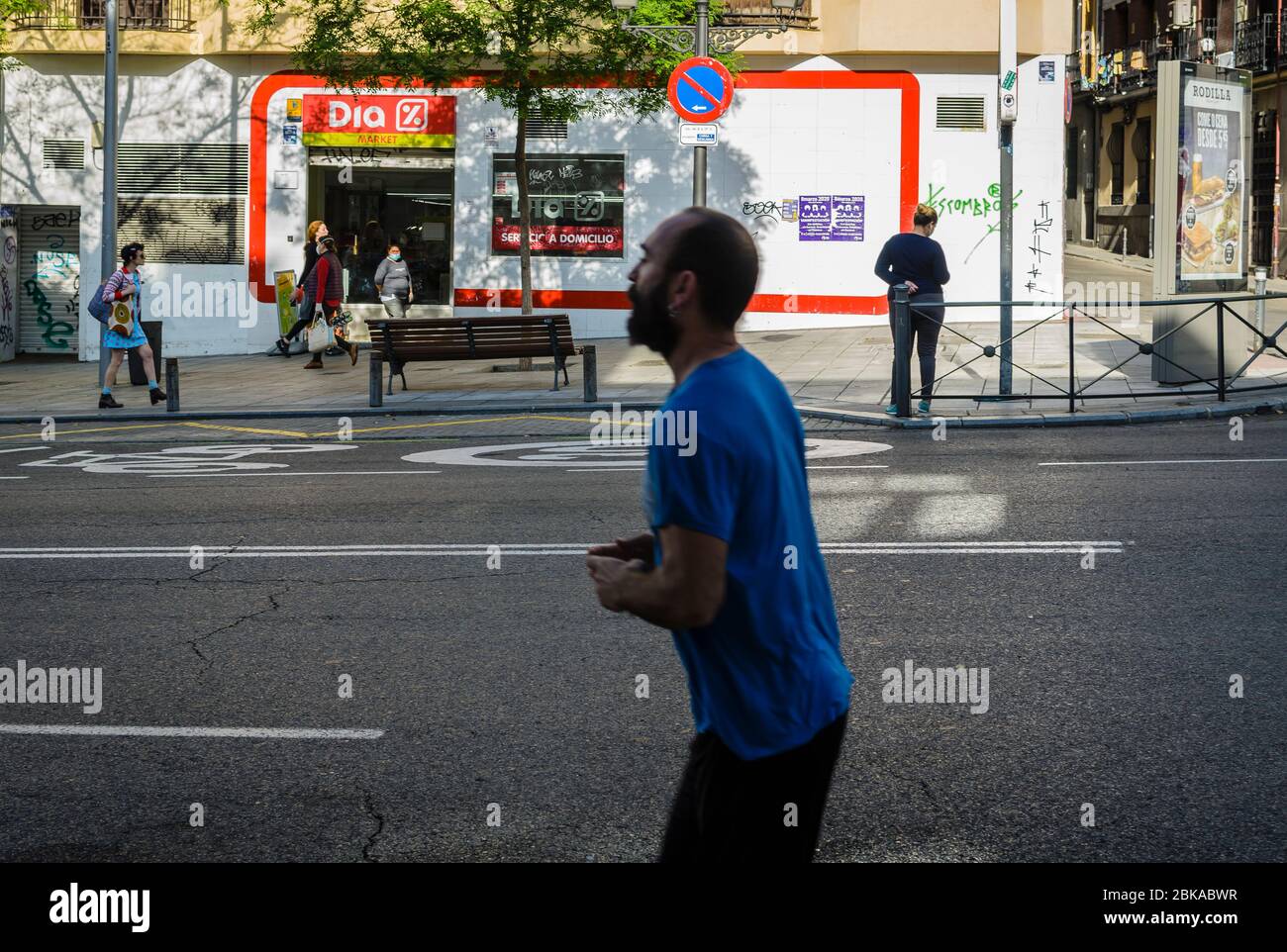 Madrid, Spain, 2 th May 2020. View of a runner in San Bernardo street the first day people can walking and practise sport due the confine by coronavir Stock Photo