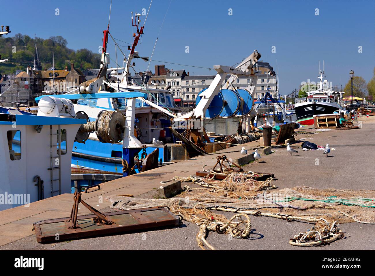 Fishing trawler and nets in the port of Honfleur, commune in the Calvados department in the lower Normandy region in northwestern France Stock Photo