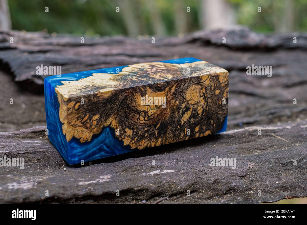 Casting epoxy resin burl wood cube on old table art background, Nature  Afzelia wooden Stock Photo - Alamy