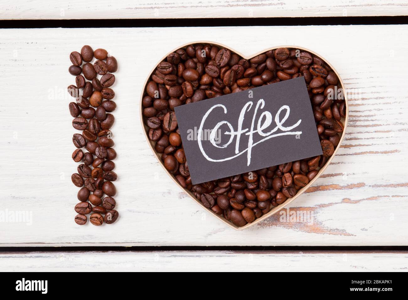 Grains roasted coffee in a shape of heard and letter I. Stock Photo