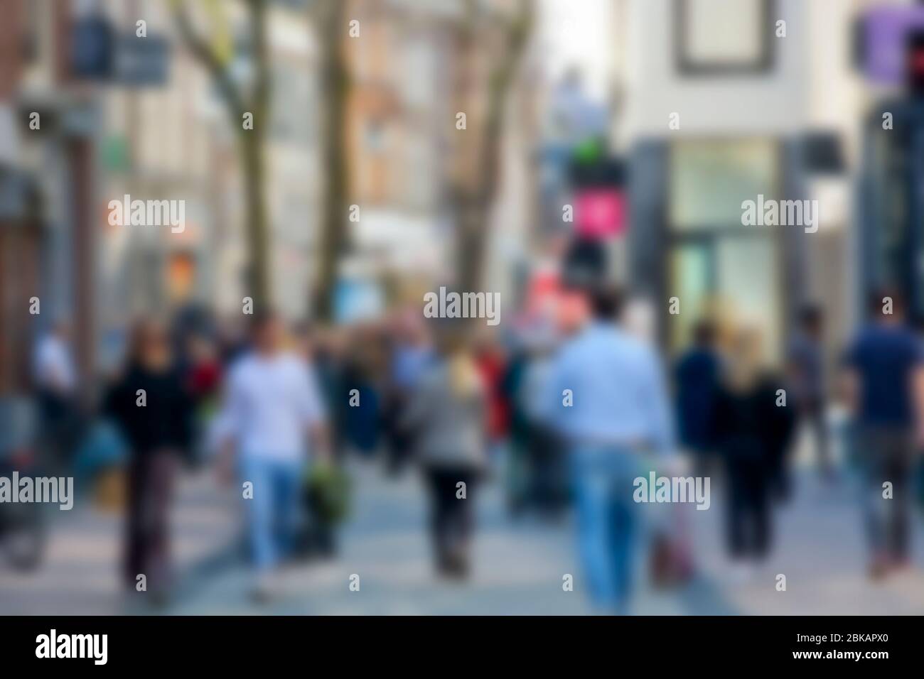 Blurred image of unrecognizable crowd of people shopping in the city street Stock Photo