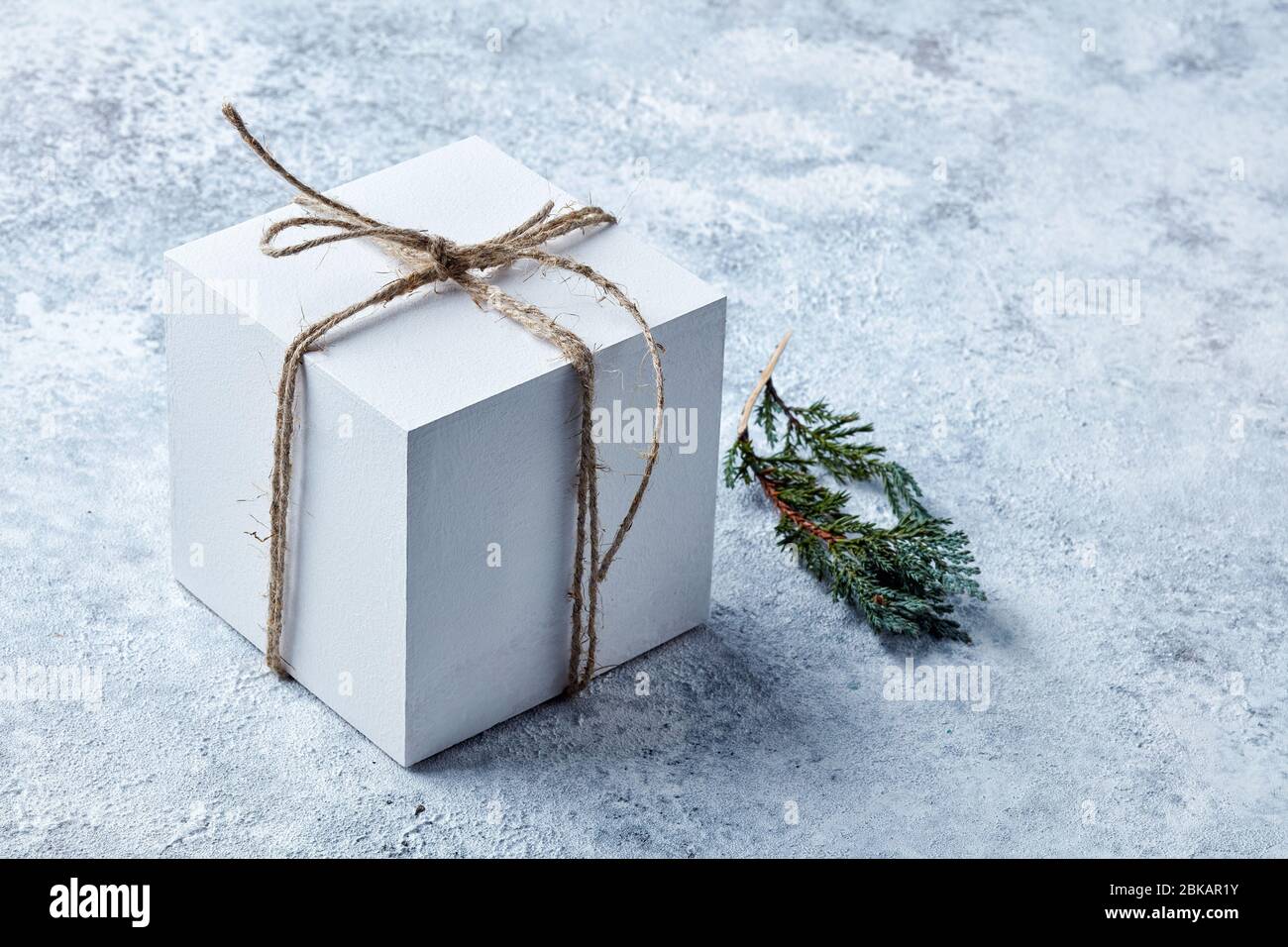 white gift box on grey painted background Stock Photo