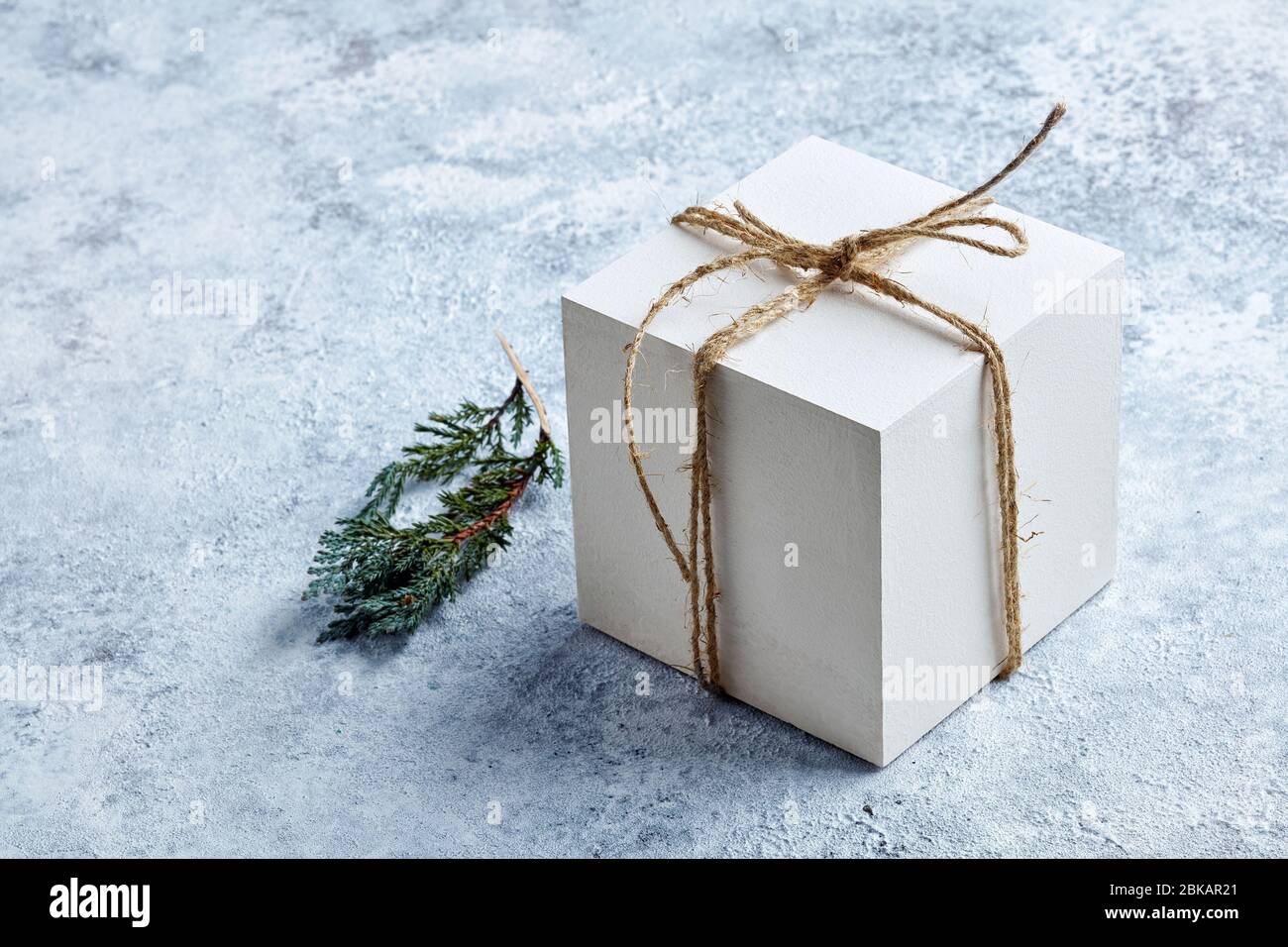 white gift box on grey painted background Stock Photo