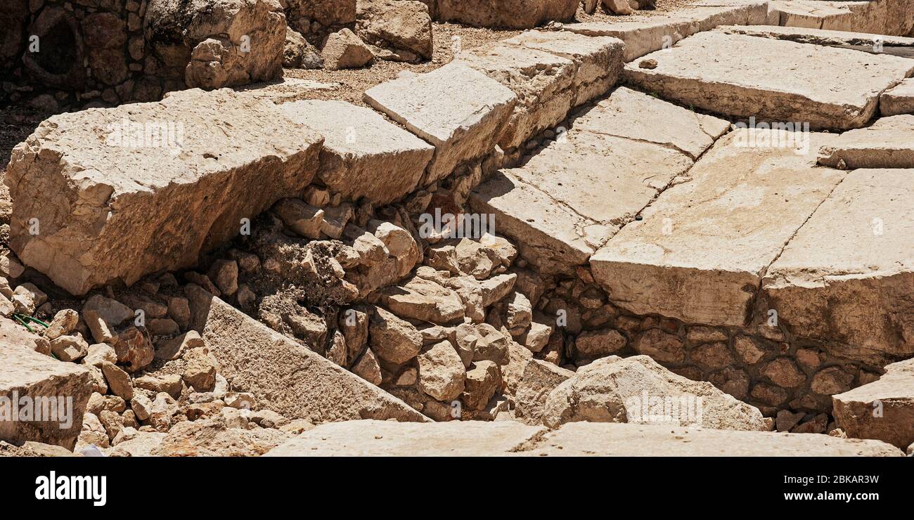 closeup detail of the dressed stones of the herodian roman street next to the ancient western wall kotel of the second temple in jerusalem Stock Photo