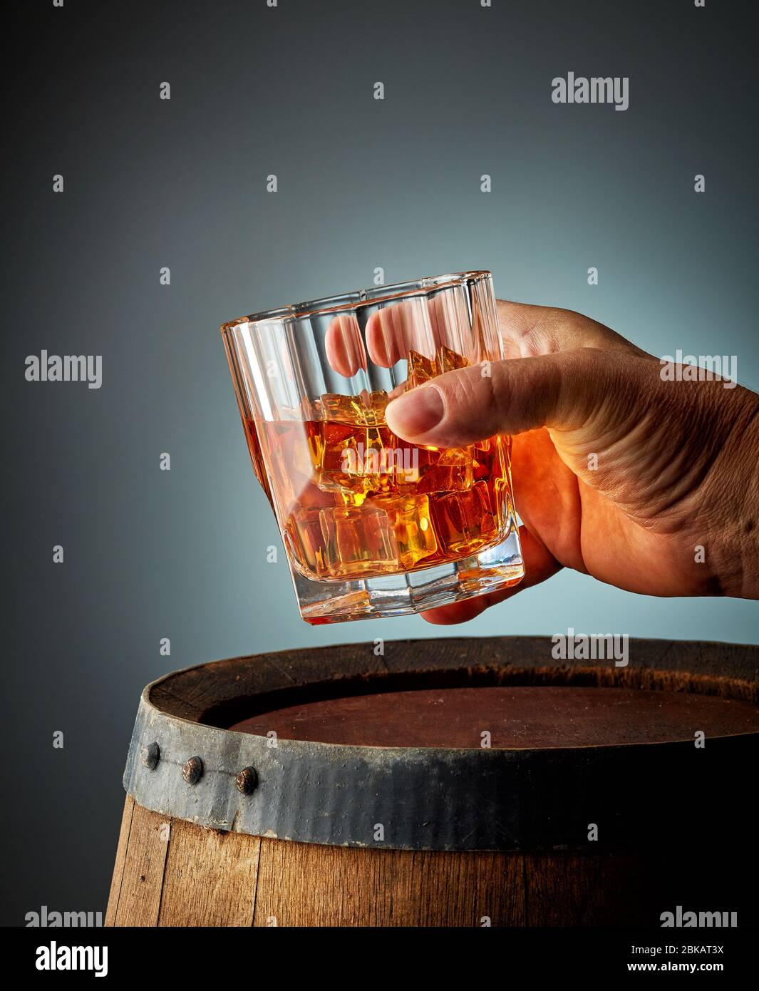 glass of whiskey in human hand Stock Photo