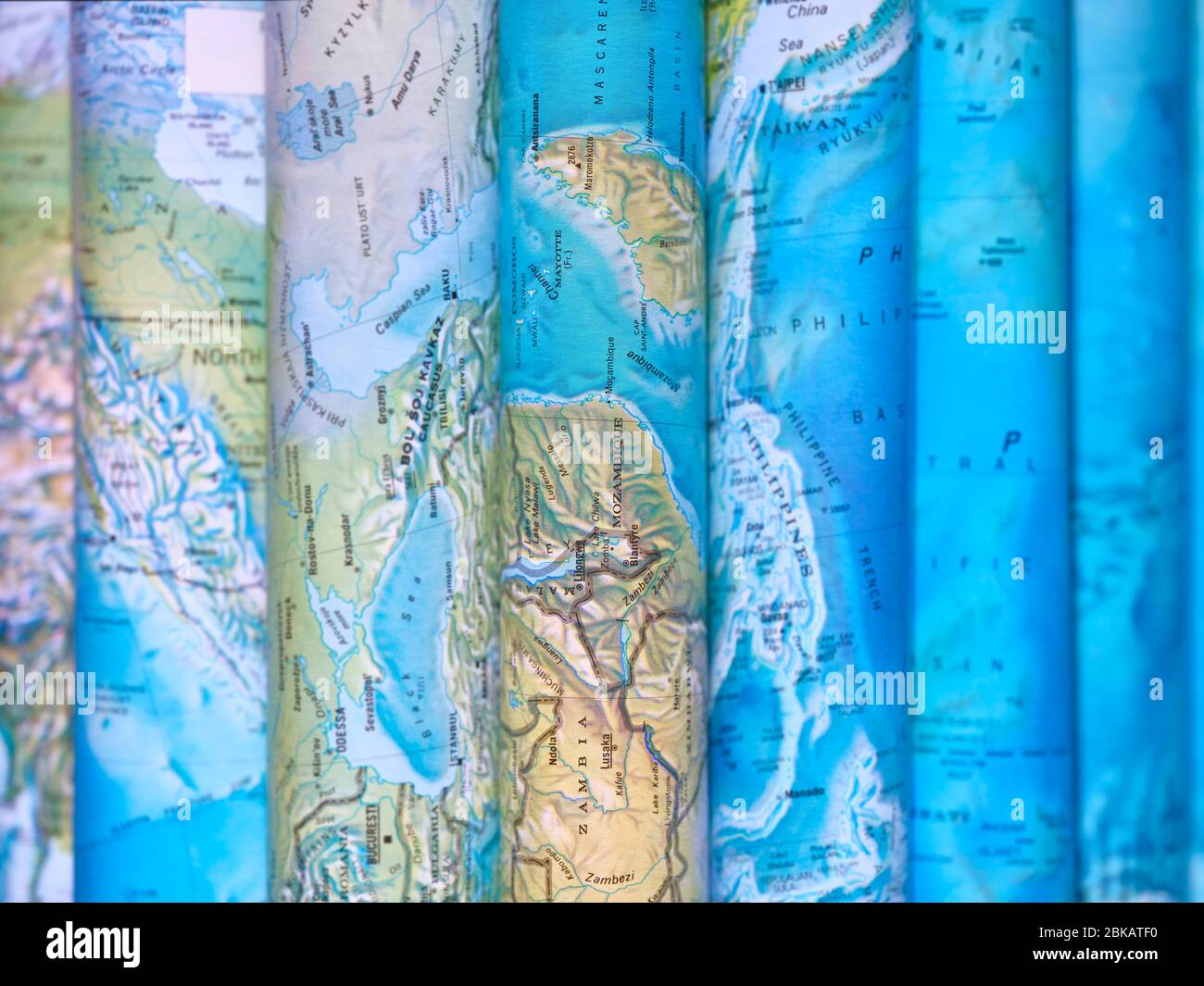 Atlas showing maps with pages folded over artistically Stock Photo