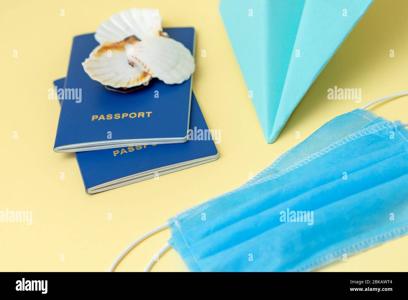 Download Passports Paper Airplane And Two Medical Face Mask On Yellow Background Coronavirus Or Covid 19 During Traveling Concept Stock Photo Alamy PSD Mockup Templates