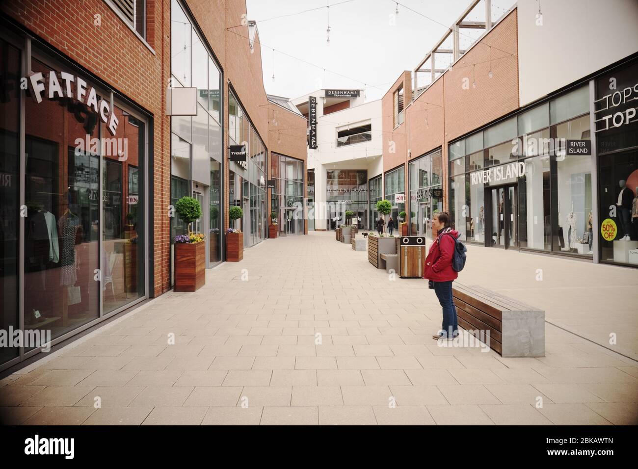 Lockdown Britain a solitary visitor looks at the closed shops in