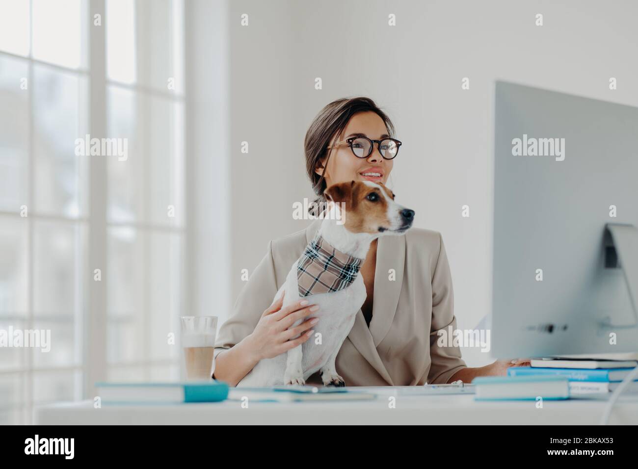 Busy Female Teacher Wears Formal Clothes And Spectacles Conducts Online 