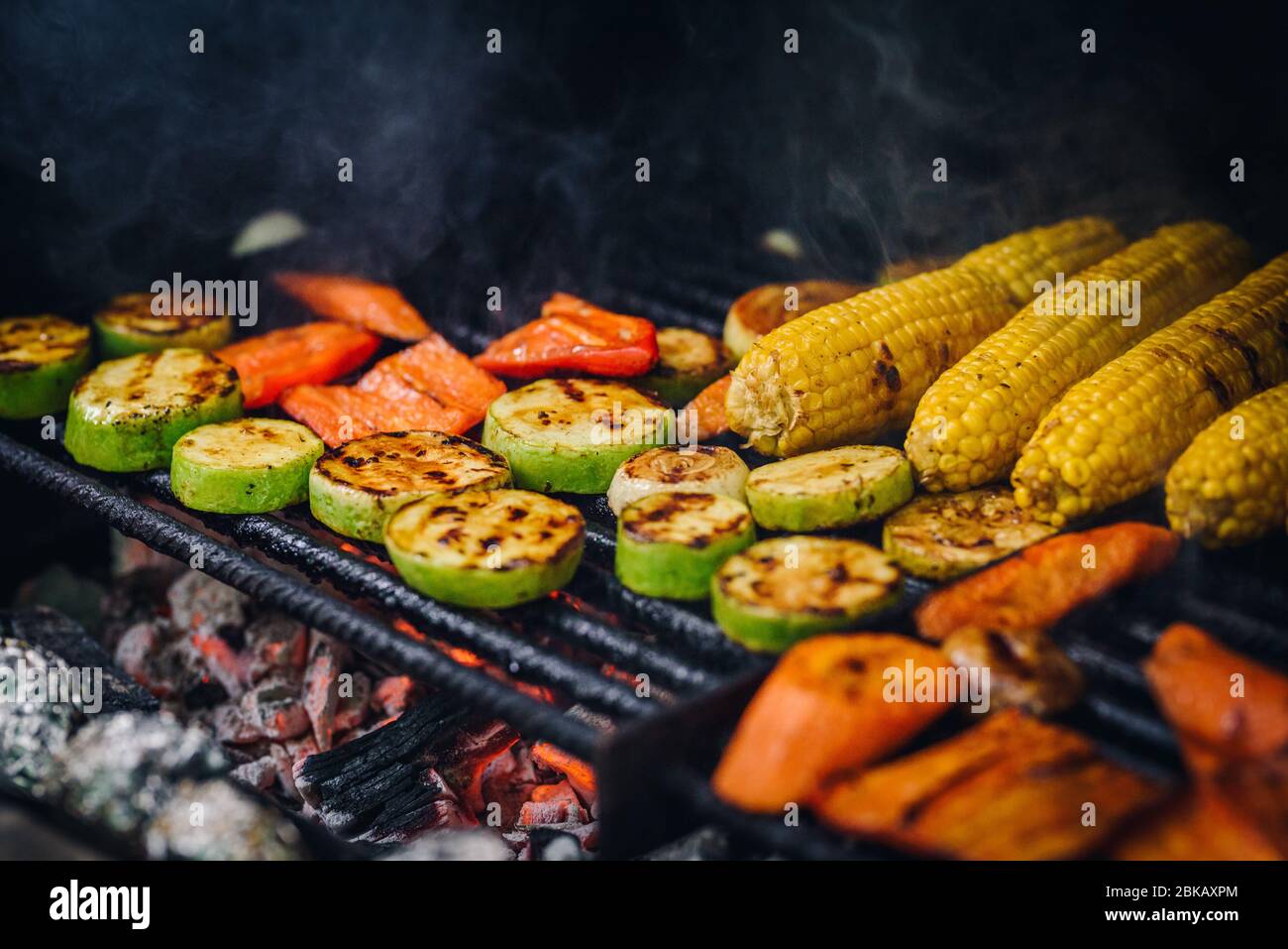 Vegetarian barbeque corn, zucchini, carrots on the barbeque Stock