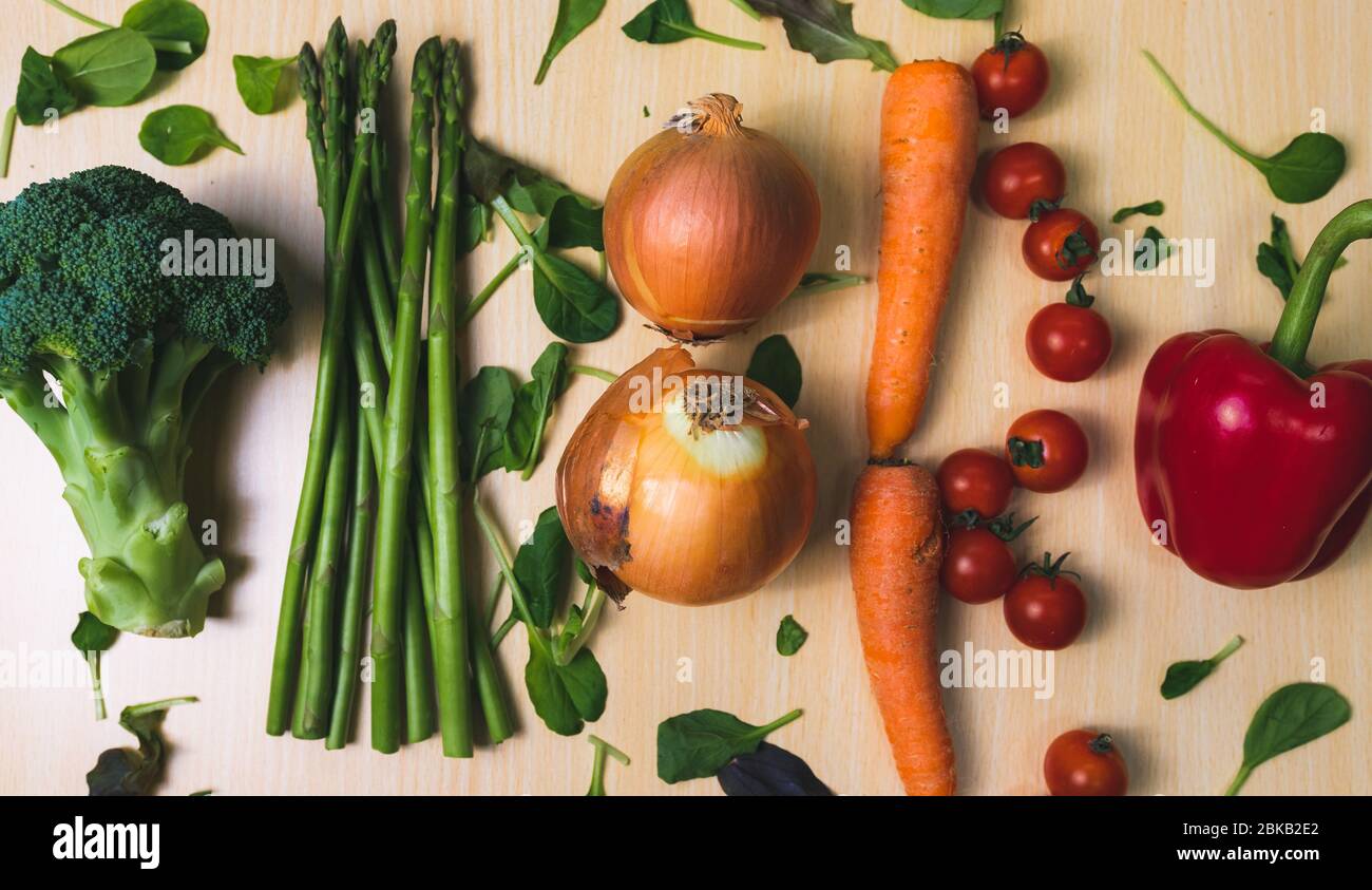 Top down image of vegetables in a row on a table. Flat lay image of vegetables in a row. Stock Photo