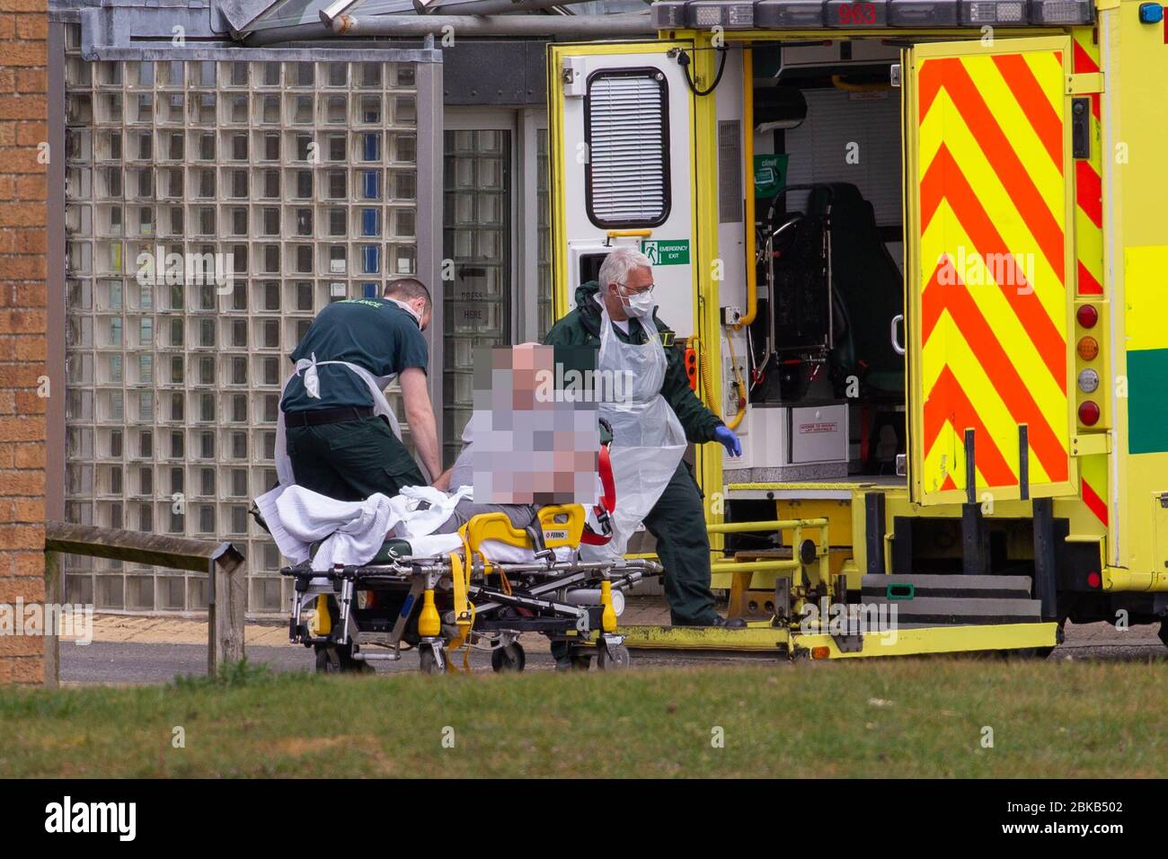 Picture dated April 29th shows ambulance crews taking in patients to the Covid-19 ward  at the Queen Elizabeth Hospital  in KingÕs Lynn in Norfolk on Wednesday afternoon.  Ambulance drivers were today (Wed) seen delivering patients with suspected coronavirus into the hospital close to the QueenÕs Norfolk estate C where Prince William and Kate are currently staying with their children.  NHS staff were seen pushing the patients on trollies into the Queen Elizabeth Hospital (QEH) in KingÕs Lynn, which is just six miles from Sandringham, where the Royal couple are currently living at Anmer Hall wi Stock Photo