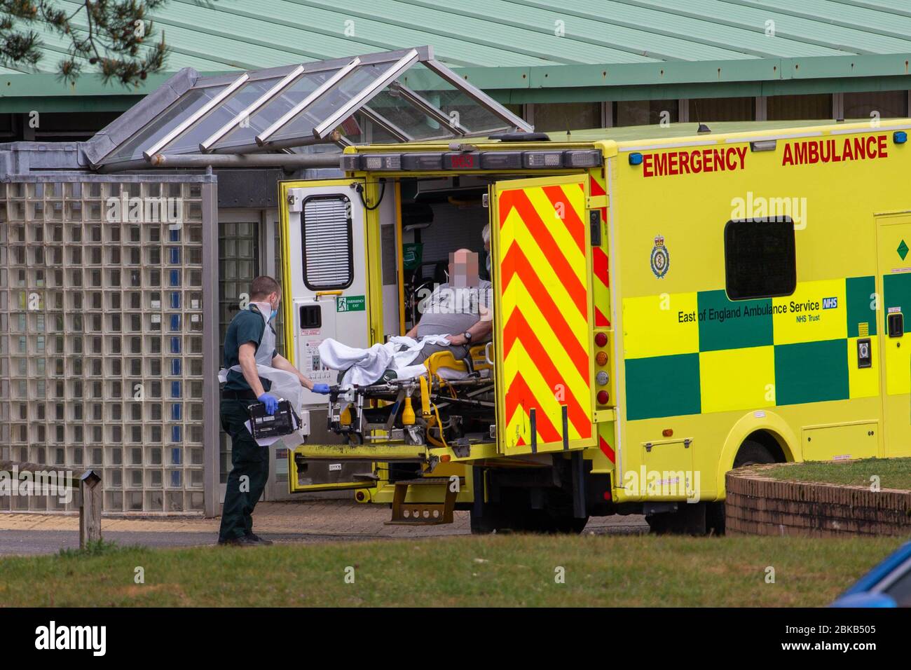 Picture dated April 29th shows ambulance crews taking in patients to the Covid-19 ward  at the Queen Elizabeth Hospital  in KingÕs Lynn in Norfolk on Wednesday afternoon.  Ambulance drivers were today (Wed) seen delivering patients with suspected coronavirus into the hospital close to the QueenÕs Norfolk estate C where Prince William and Kate are currently staying with their children.  NHS staff were seen pushing the patients on trollies into the Queen Elizabeth Hospital (QEH) in KingÕs Lynn, which is just six miles from Sandringham, where the Royal couple are currently living at Anmer Hall wi Stock Photo