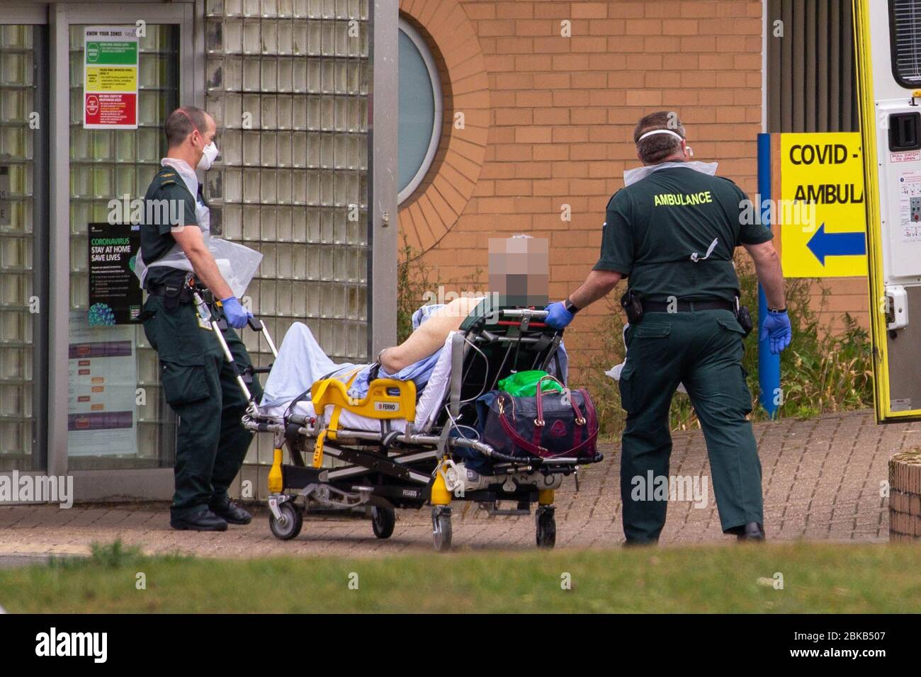 Picture dated April 29th shows ambulance crews taking in patients to the Covid-19 ward  at the Queen Elizabeth Hospital  in KingÕs Lynn in Norfolk on Wednesday afternoon.  Ambulance drivers were today (Wed) seen delivering patients with suspected coronavirus into the hospital close to the QueenÕs Norfolk estate C where Prince William and Kate are currently staying with their children.  NHS staff were seen pushing the patients on trollies into the Queen Elizabeth Hospital (QEH) in KingÕs Lynn, which is just six miles from Sandringham, where the Royal couple are currently living at Anmer Hall wi Stock Photo
