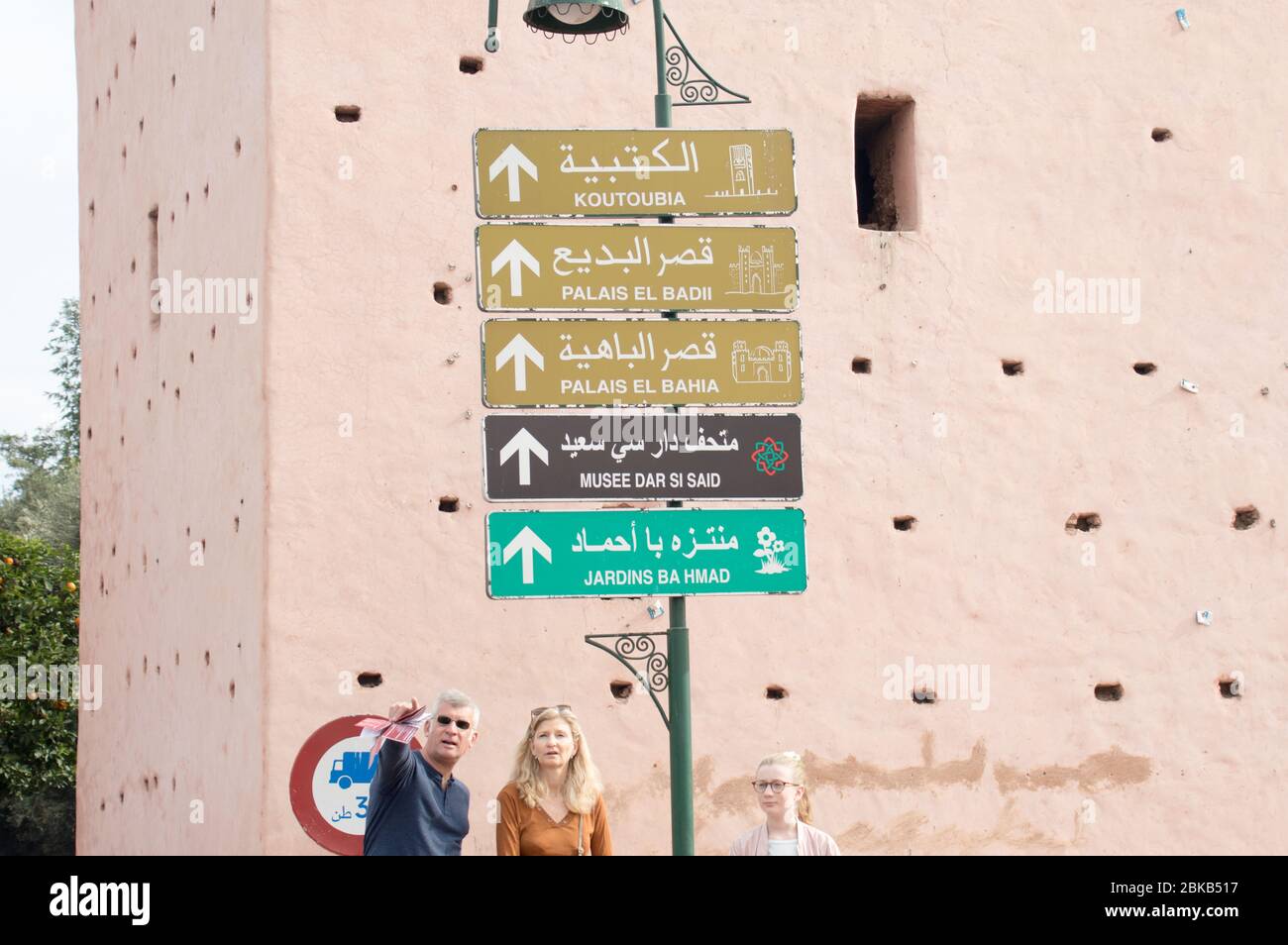 Direction sign boards in the city of Marrakech with Arabic and English letters (Marrakesh) giving directions to famous landmark, Morocco, North Africa Stock Photo