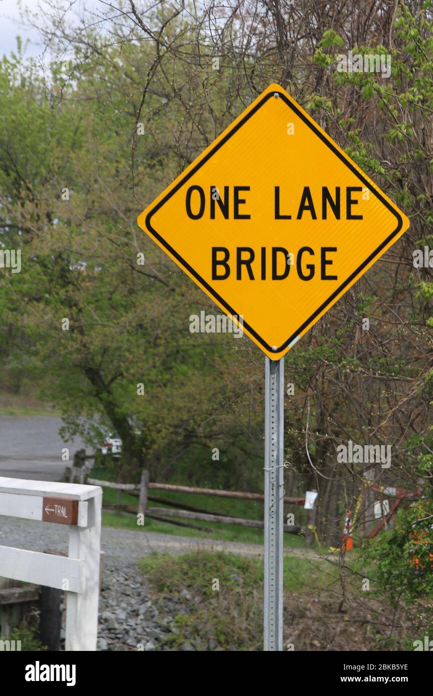 The sign says, look out for a one lane bridge. Stock Photo