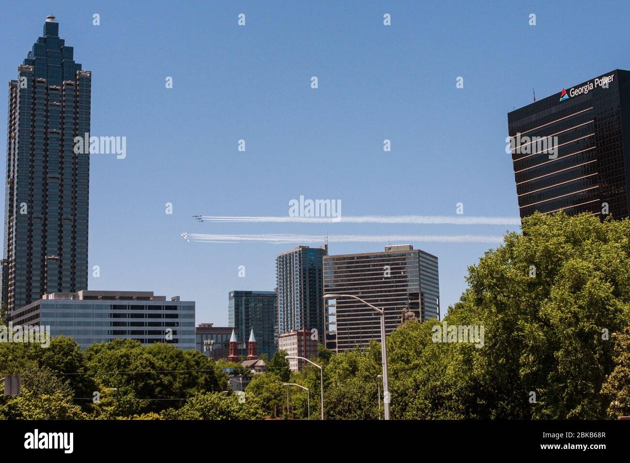 The Navy Blue Angels and Air Force Thunderbirds fly over downtown Atlanta to honor healthcare frontline workers in Atlanta, GA, on May 2, 2020. Stock Photo