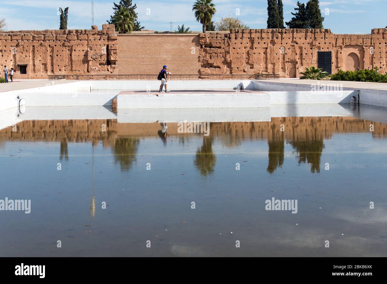 Ruins of El Badi Palace with a water body view where a man and his  reflection are visible in water, Marrakesh (Marrakech), Morocco, North  Africa Stock Photo - Alamy