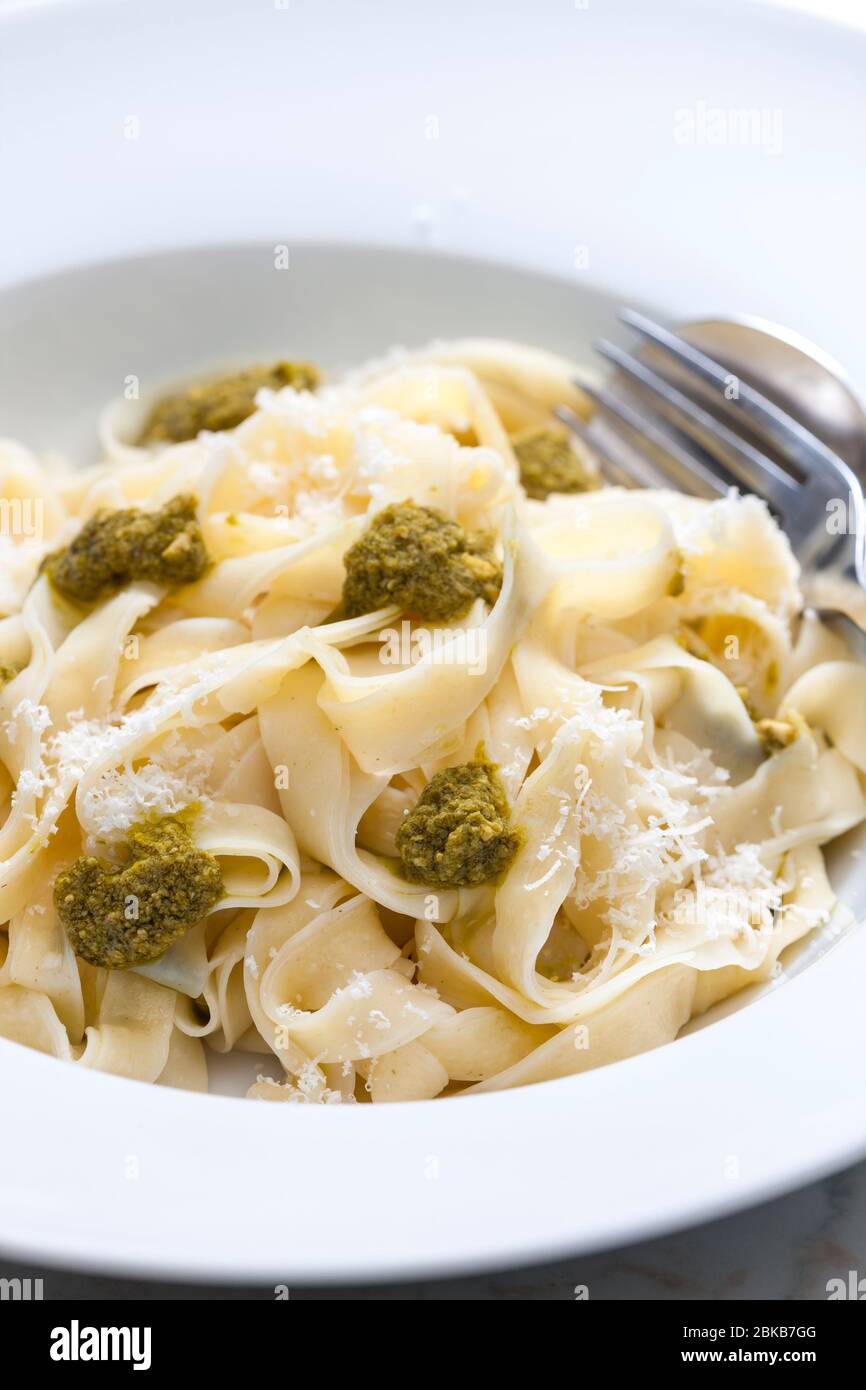 pasta tagliatelle with green pesto Stock Photo Alamy