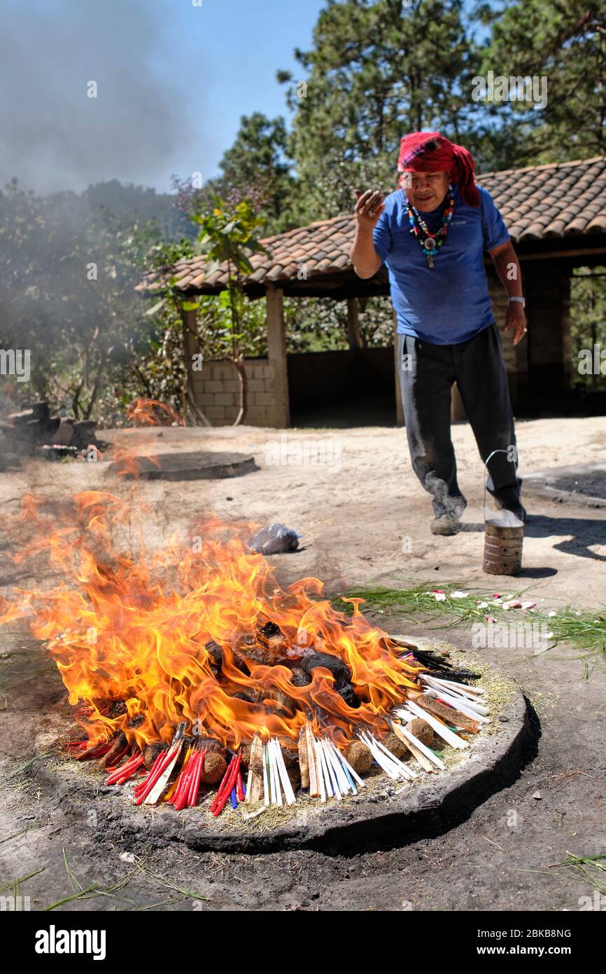 Shaman performing a Mayan healing ceremony for a family on the top of ...