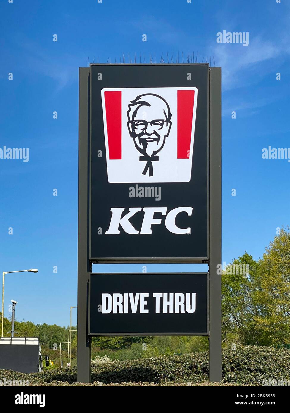 Ashford, United Kingdom - April 23, 2020: An outdoor KFC  drive thru restaurant sign.   KFC is the world's second-largest restaurant chain after McDon Stock Photo