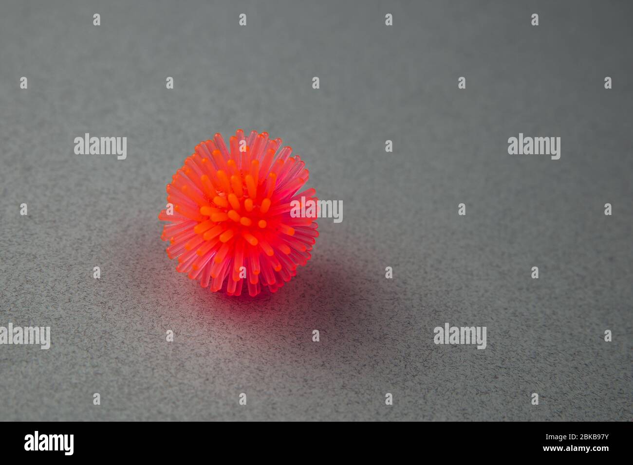 Abstract virus strain model of Coronavirus disease COVID-19 on a grey background . Copy space. Virus Pandemic Protection Concept Stock Photo