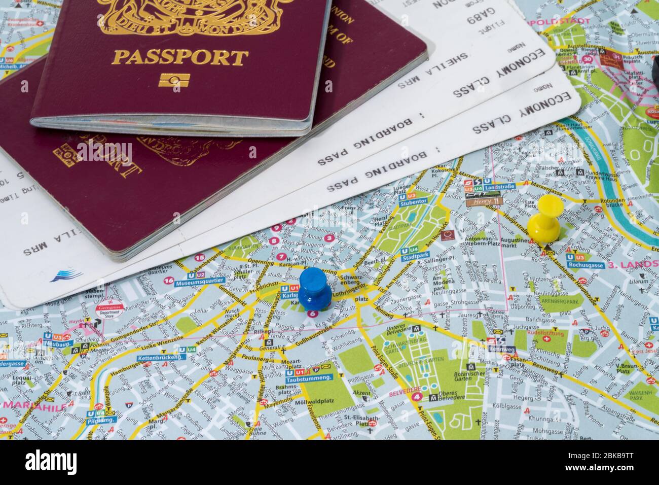 Maps with pins and passports, planning the holidays Stock Photo Alamy