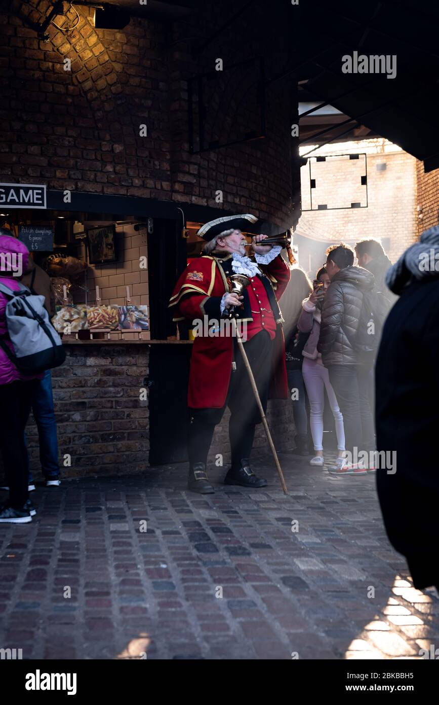 Spectacular sunlight and Guinness Record holder Alan Myatt the Town Crier in Camden Market in London England Stock Photo