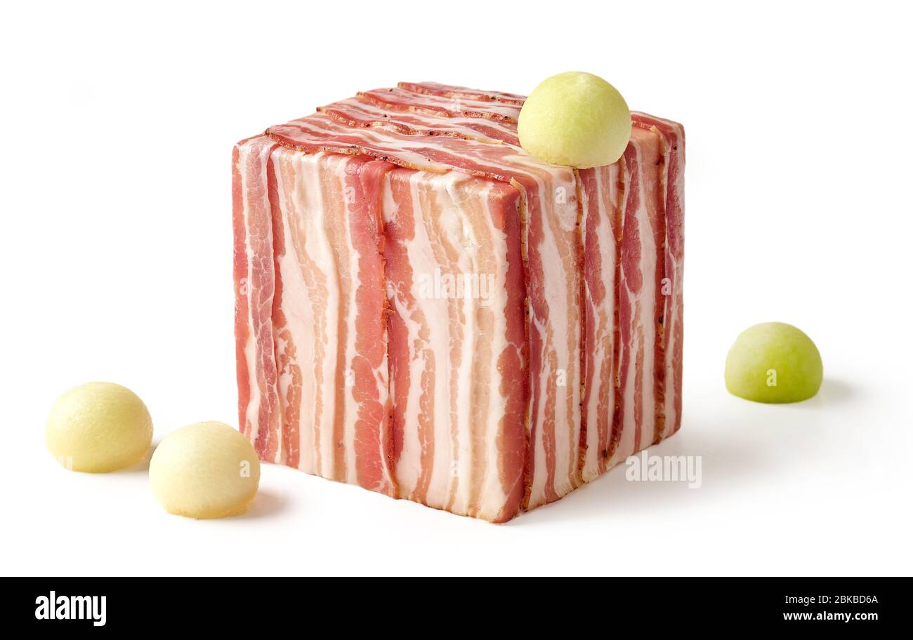 cube of prosciutto slices and melon balls isolated on white background Stock Photo