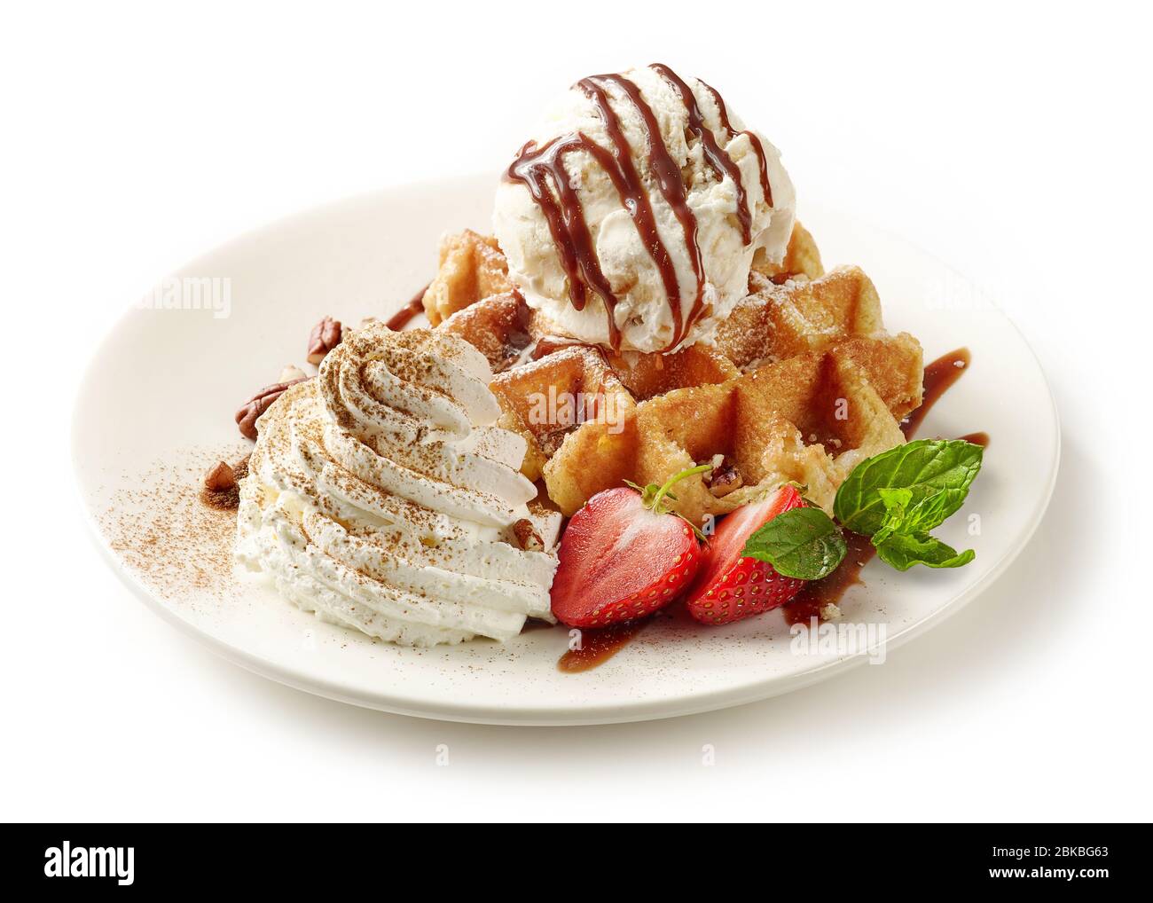 plate of belgian waffle dessert decorated with ice cream and berries ...