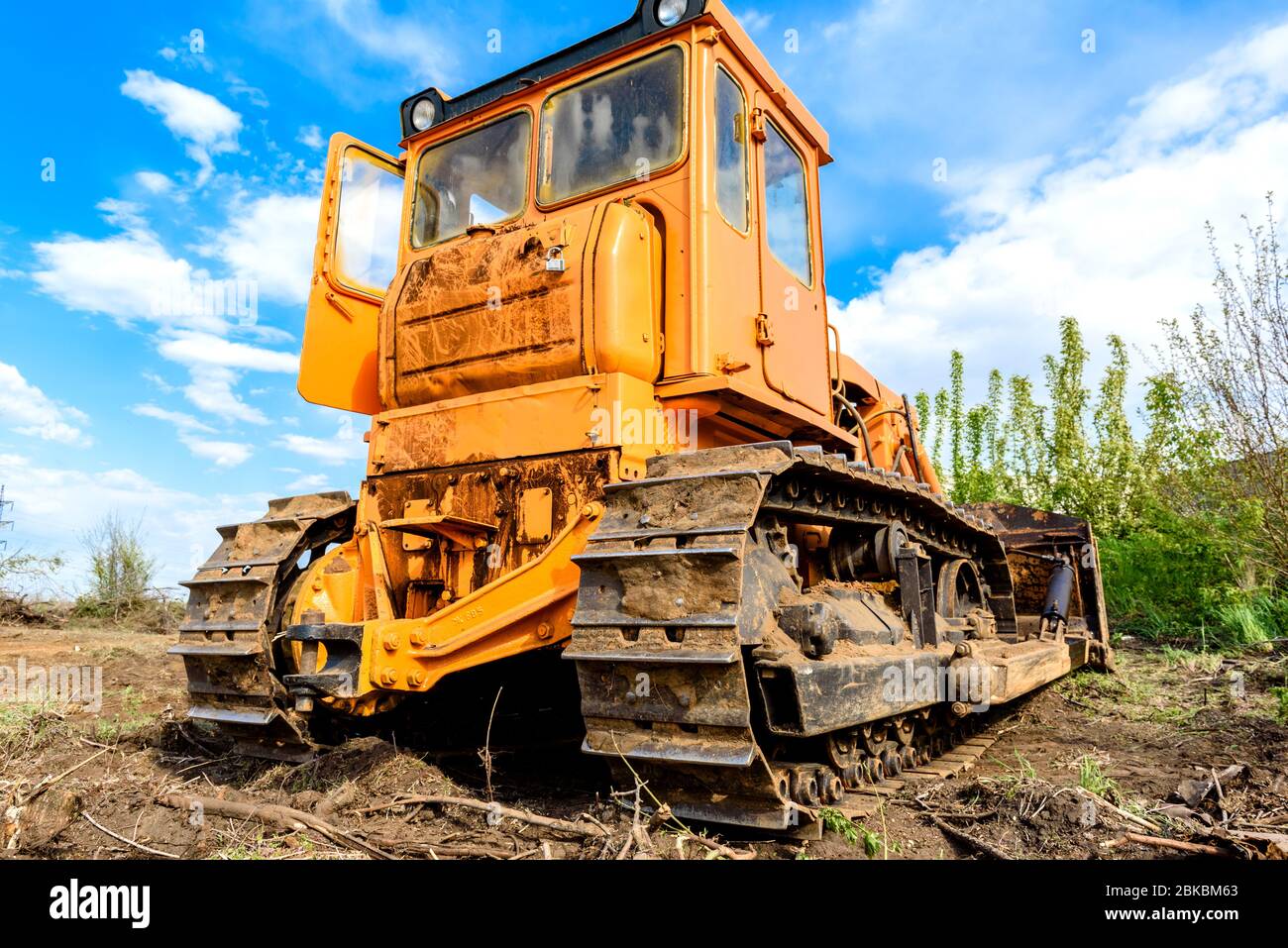 Industrial building construction site bulldozer leveling and moving