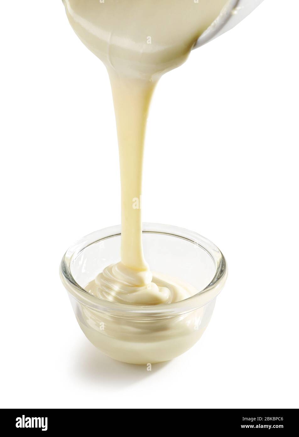 pouring melted white chocolate isolated on white background Stock Photo -  Alamy