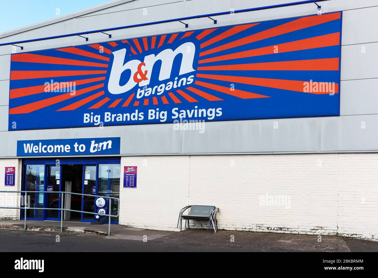 Trademark logo for B and M bargains general store on the outside wall, Irvine, Ayrshire, Scotland, UK Stock Photo