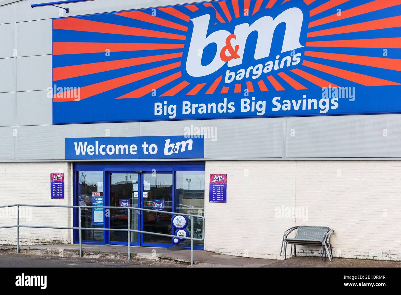 Trademark logo for B and M bargains general store on the outside wall, Irvine, Ayrshire, Scotland, UK Stock Photo