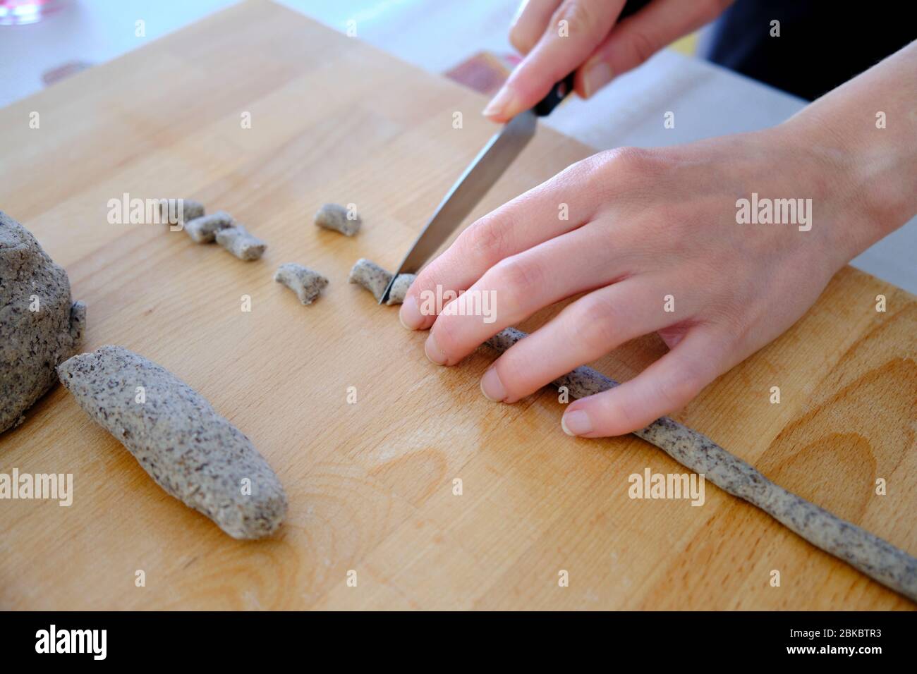 Homemade preparation of Italian gnocchi made with buckwheat flour. It is a gluten-free dish suitable for people with celiac disease. Stock Photo
