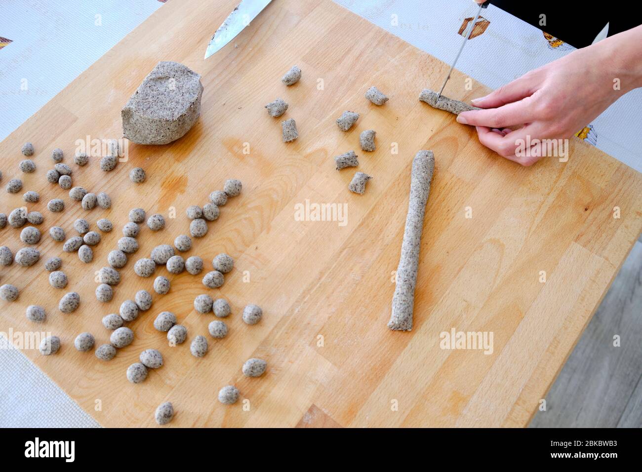 Homemade preparation of Italian gnocchi made with buckwheat flour. It is a gluten-free dish suitable for people with celiac disease. Stock Photo