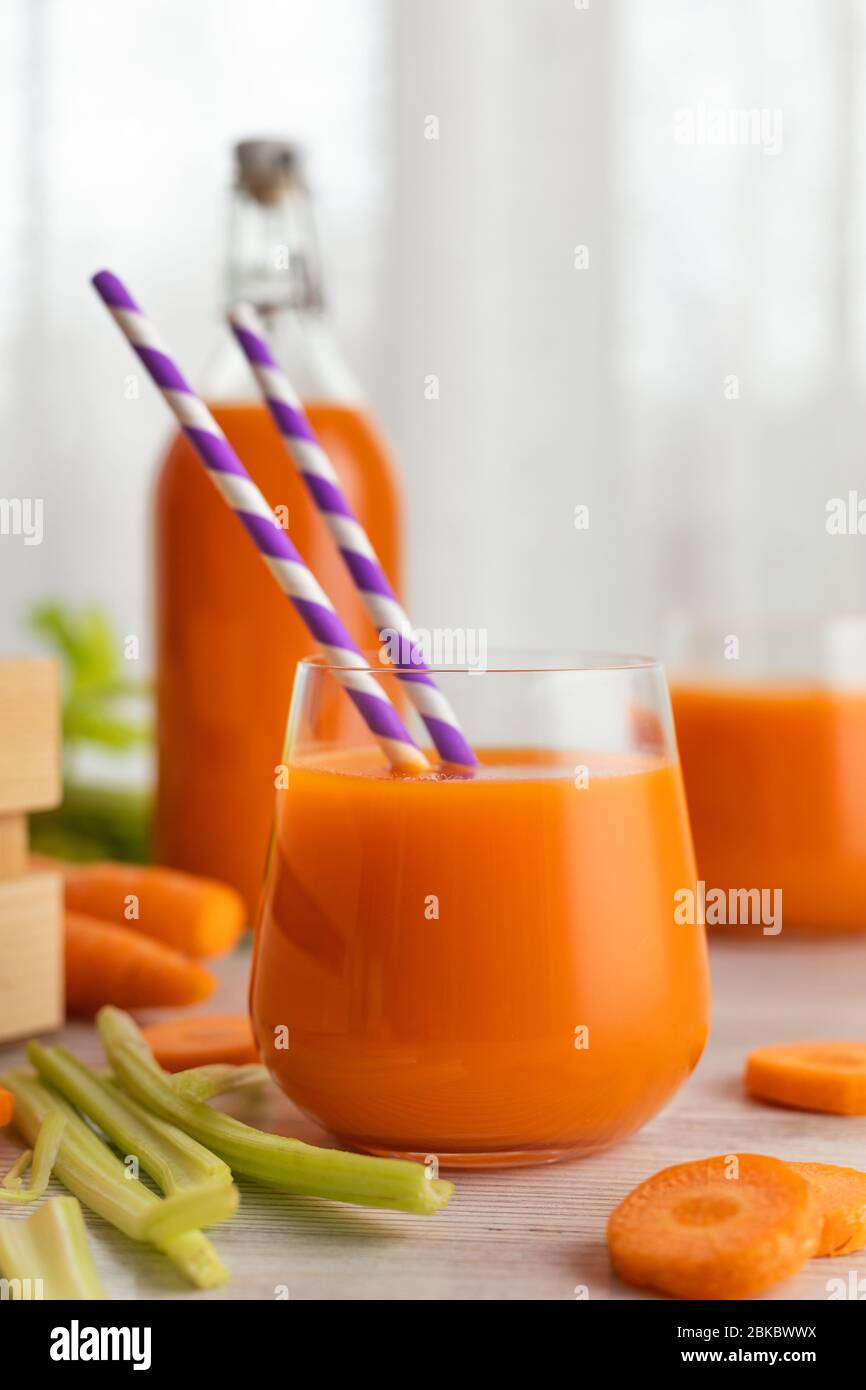 Glass with carrot juice and celery. The concept of a healthy diet or weight loss. Stock Photo