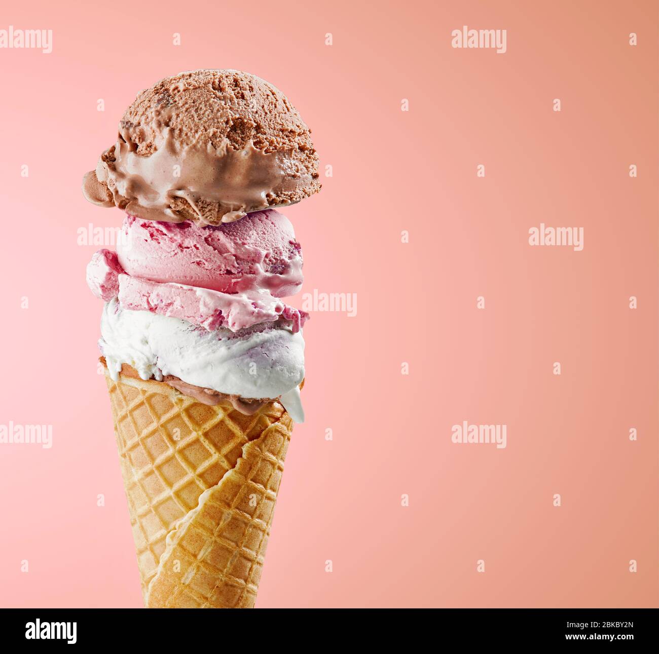 various ice cream balls in waffle cone isolated on pink background ...