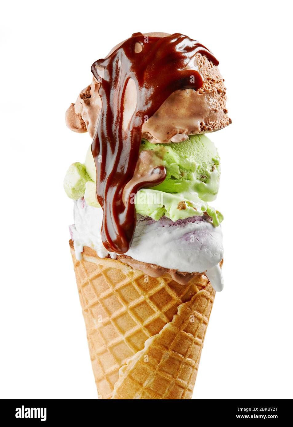 various ice cream balls with chocolate sauce in waffle cone isolated on ...