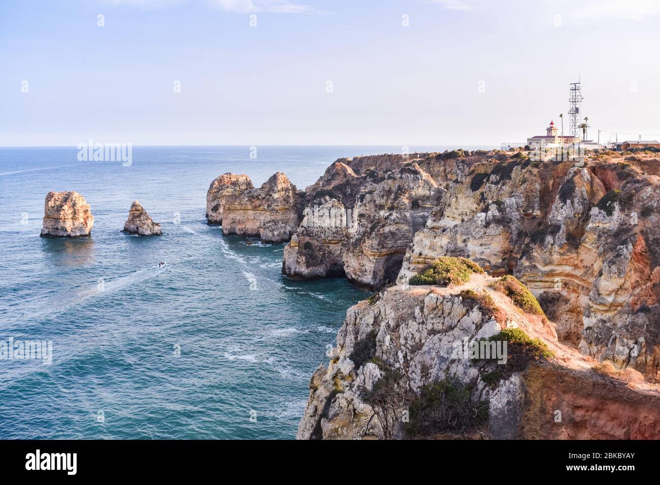 Views Of Ponta Da Piedade Lighthouse And The Cliffs At Sunset Concept views-of-ponta-da-piedade-lighthouse-and-the-cliffs-at-sunset-concept