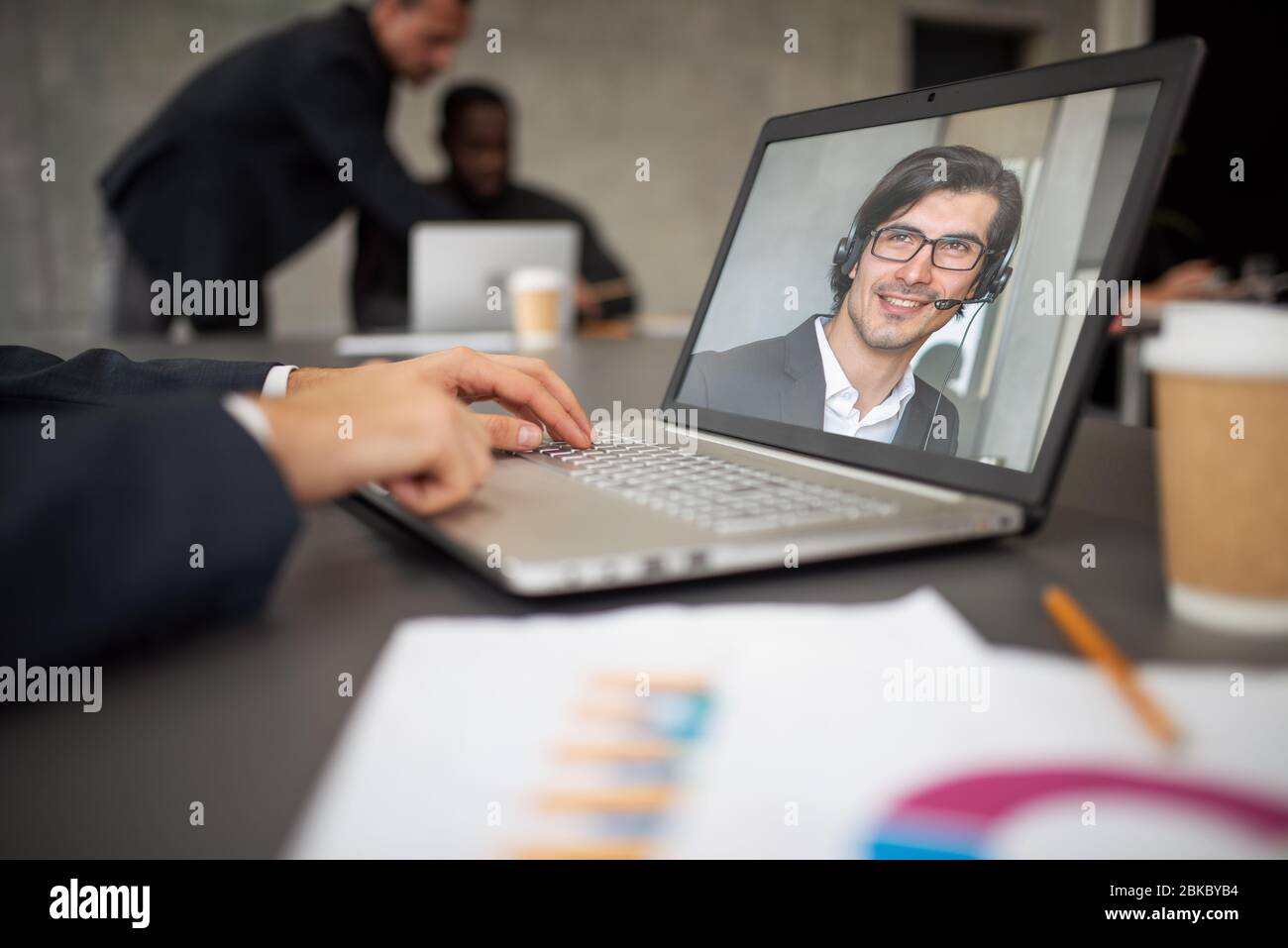 Businessman is working in remote with a videocall due to quarantine of coronavirus covid19. Concept of smart working Stock Photo