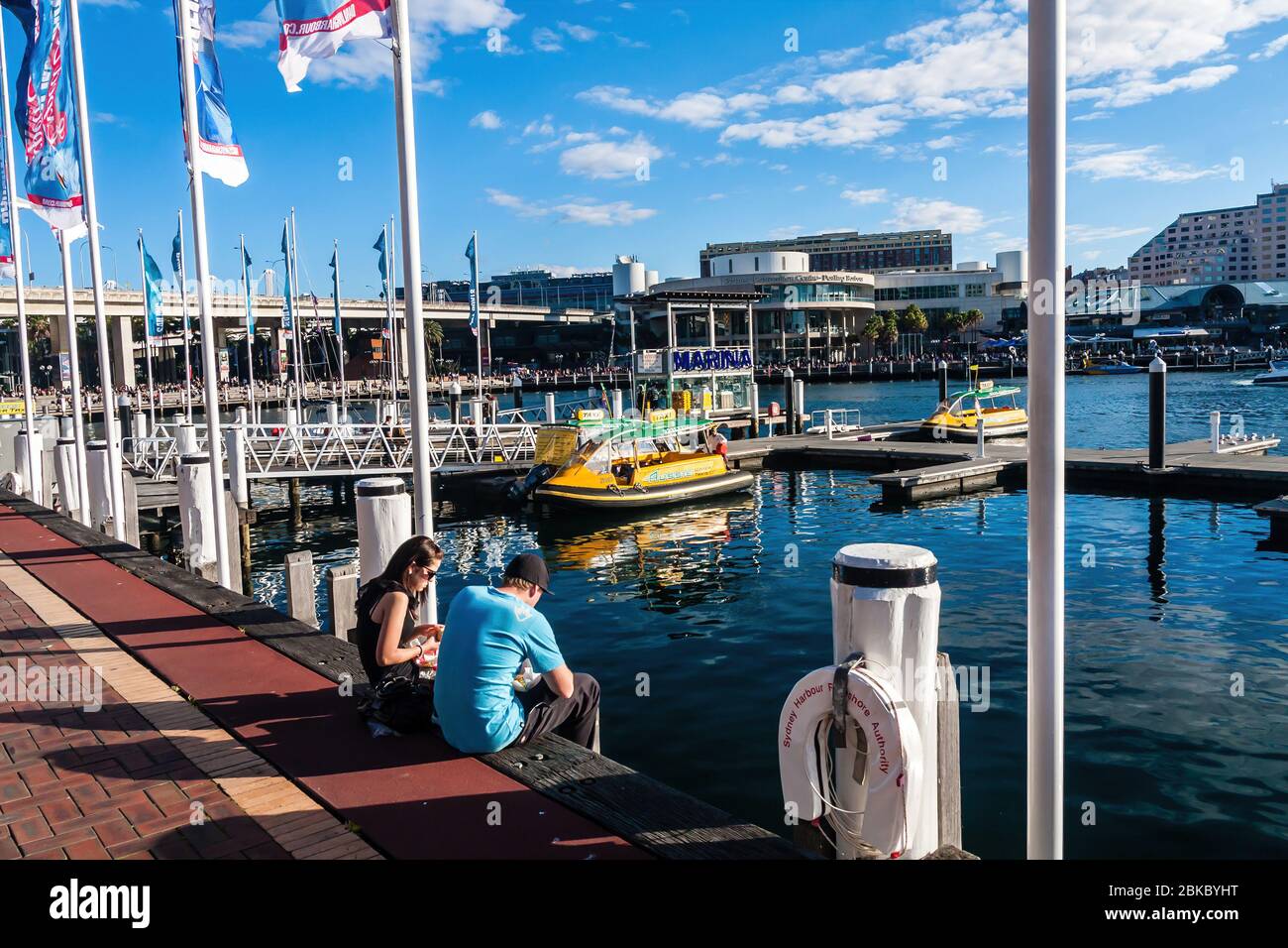 Sydney, Australia - July 3, 2011: Darling Harbour and water taxis at the marina on a sunny day Stock Photo